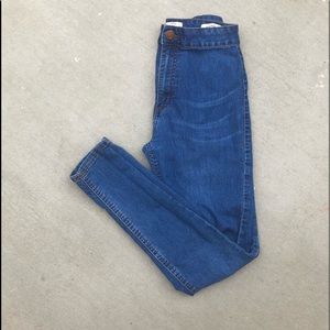 High waisted light blue jeans